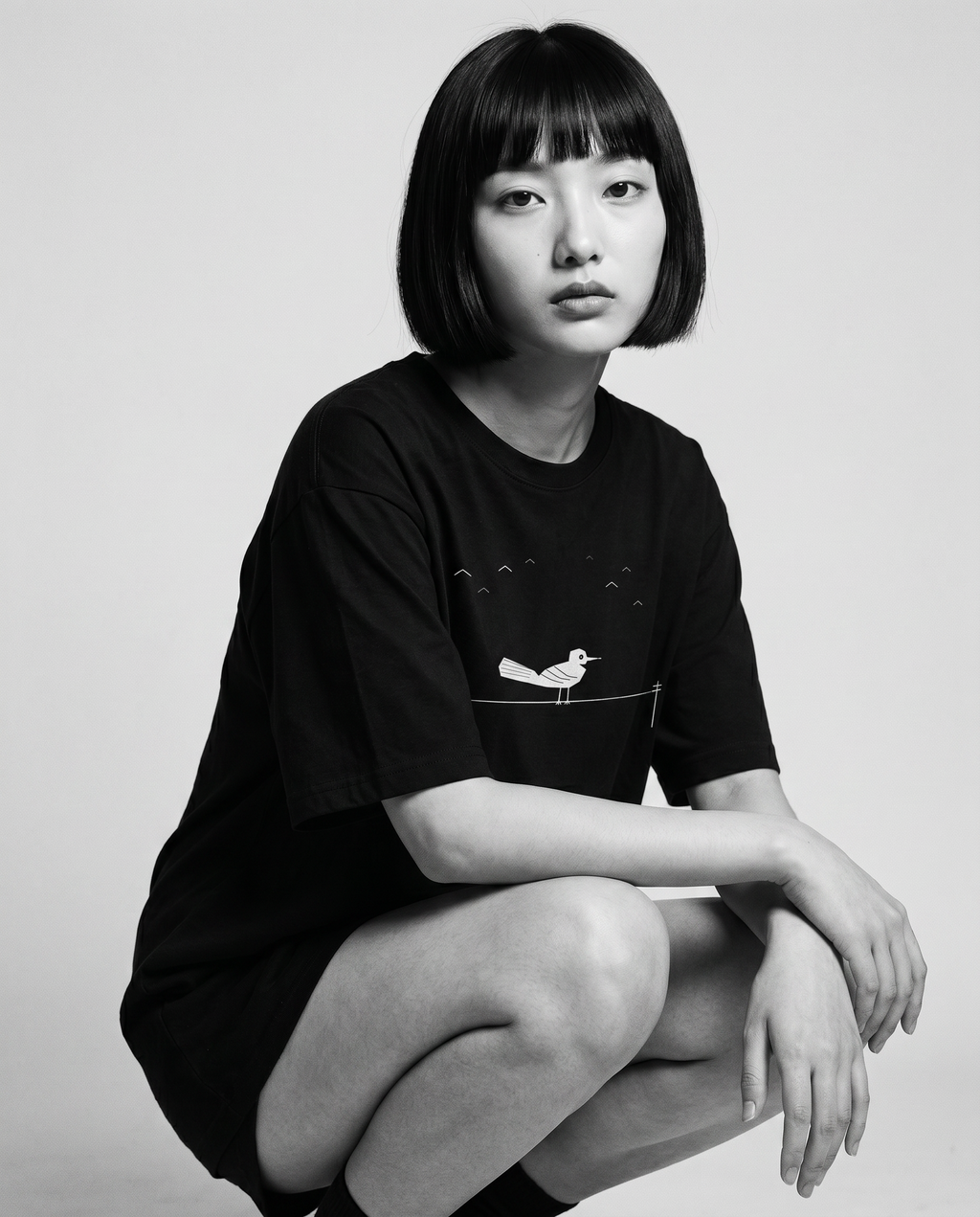 Nagi in the Kuroi Karasu Tee — crouching
