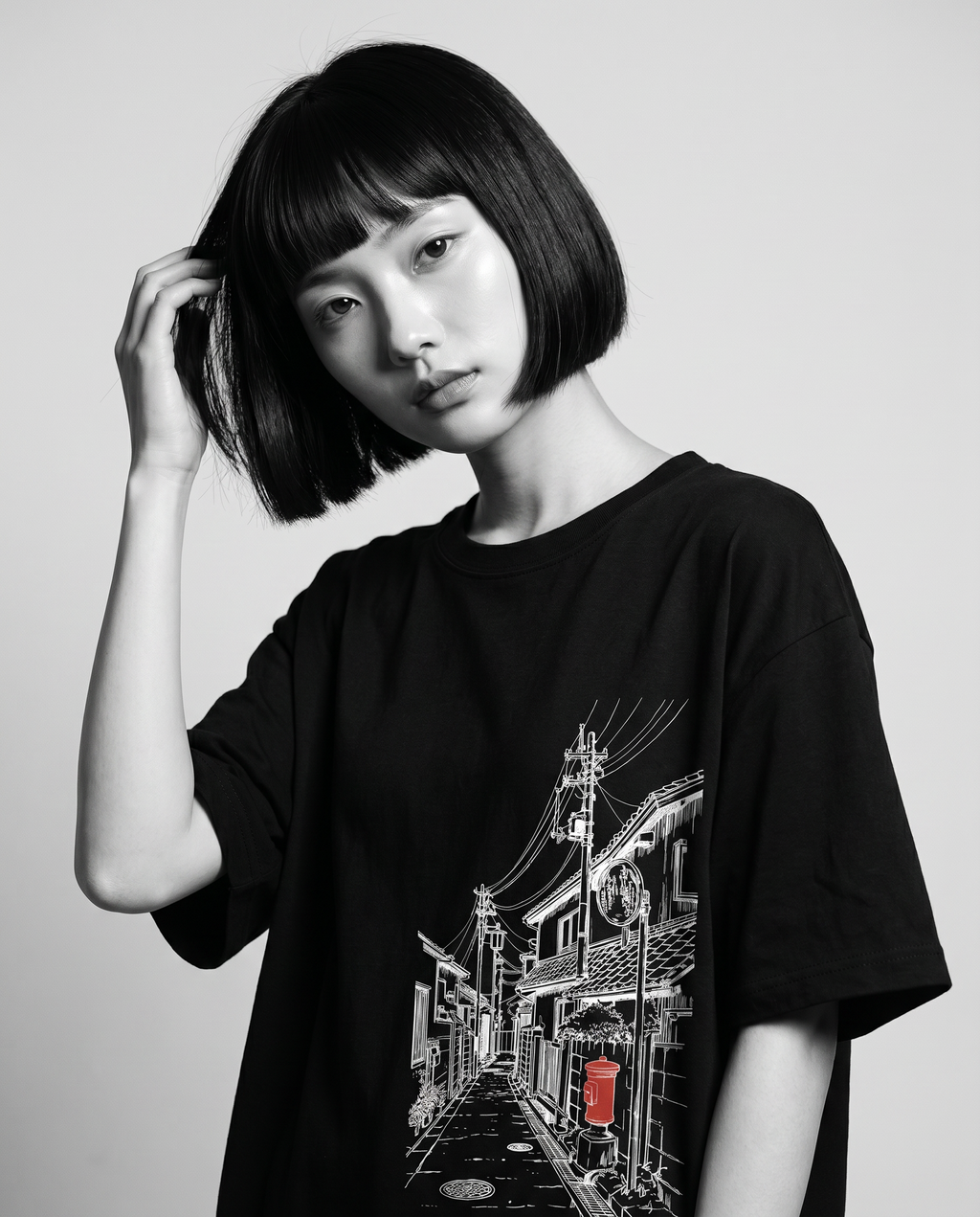 Nagi in the Kuroi Akari Koji Tee — hand in hair