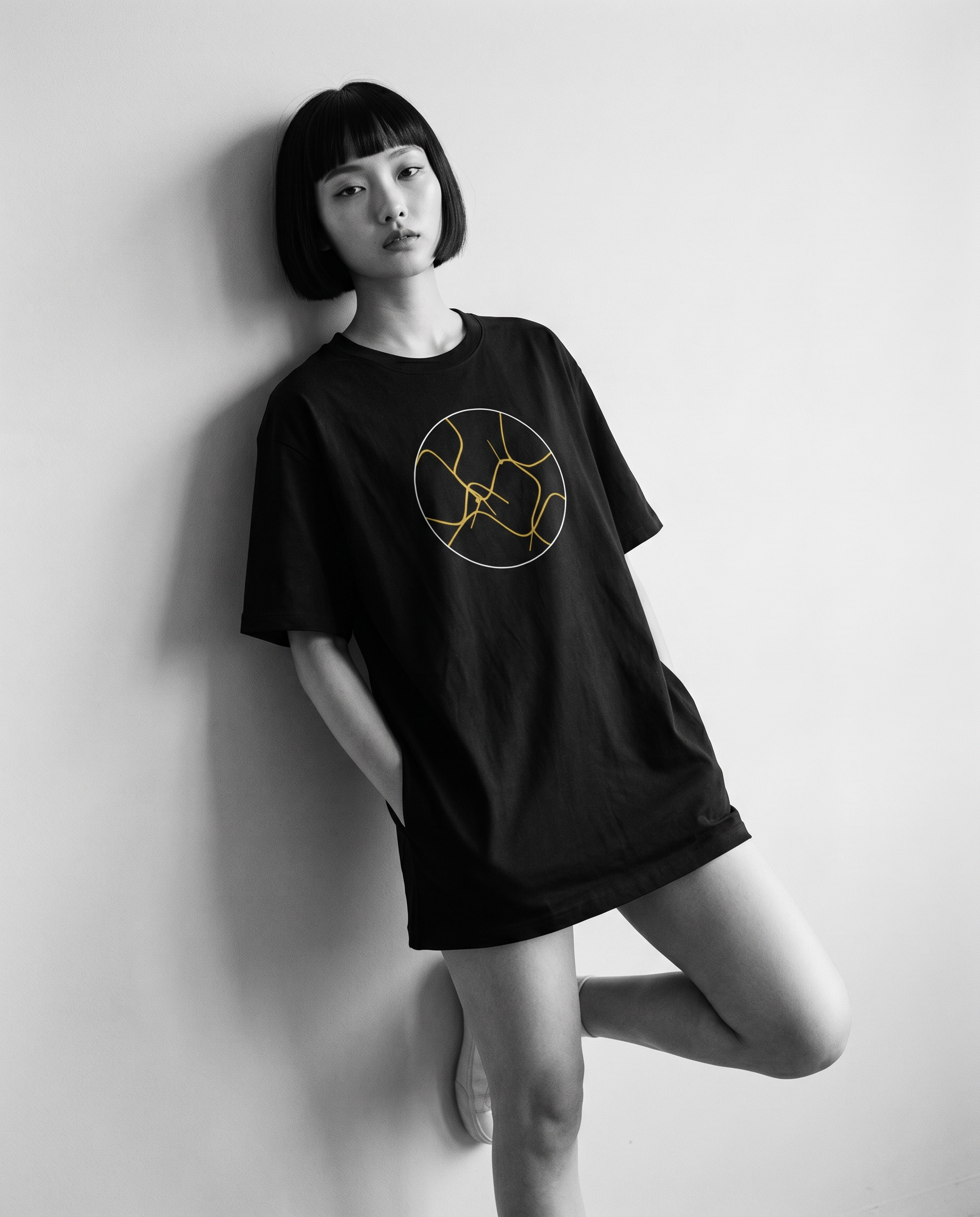Nagi in the Kuroi Kintsugi Tee — leaning
