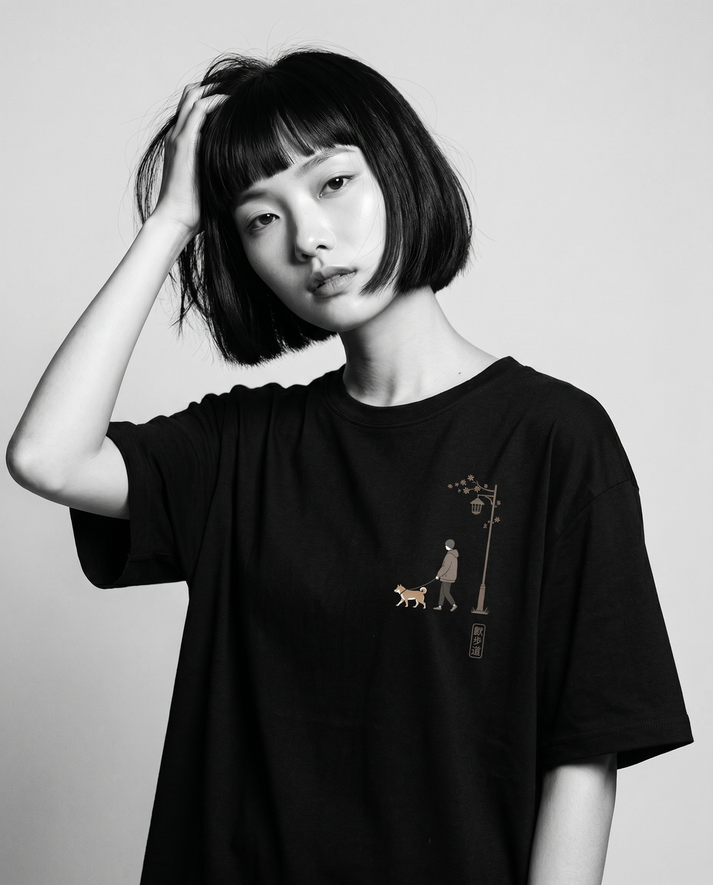 Nagi in the KUROI Sanpomichi Tee — hand in hair