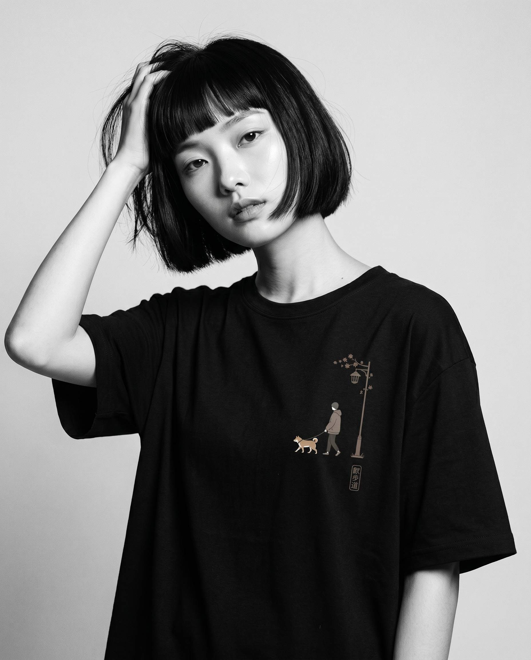 Nagi in the KUROI Sanpomichi Tee — hand in hair