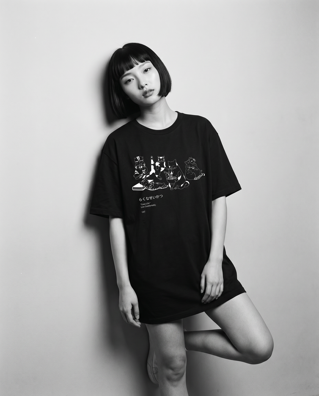 Nagi in the Kuroi Easy Life Cat Tee — leaning