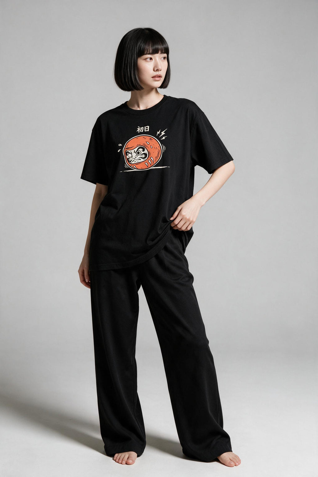 KUROI Daruma Day One oversized tee worn by model