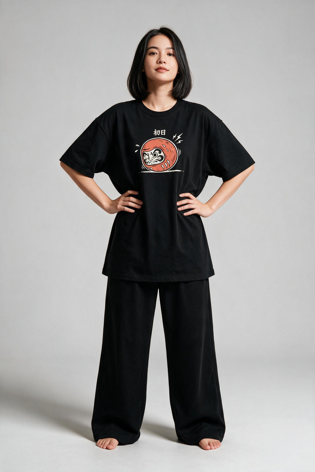 KUROI Daruma Day One oversized tee worn by model, hands on hips