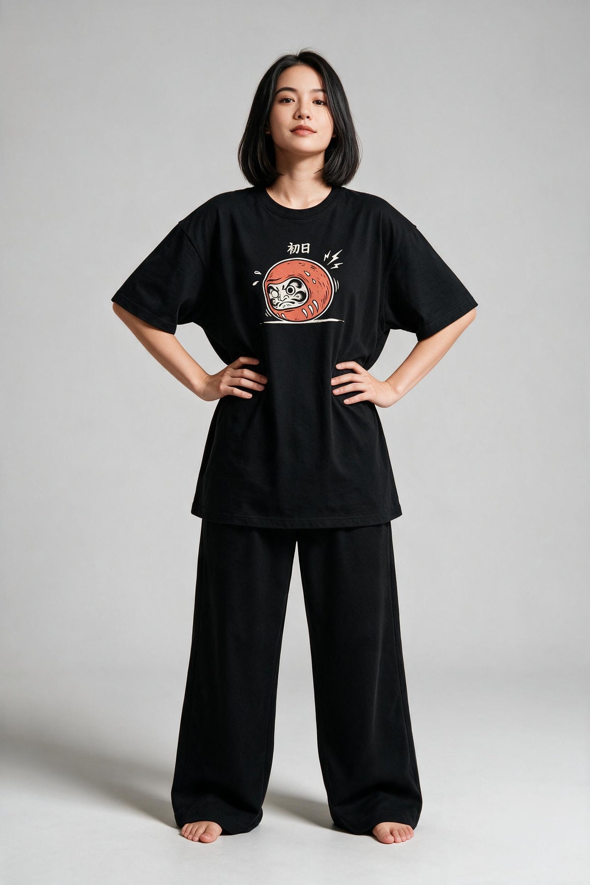 KUROI Daruma Day One oversized tee worn by model, hands on hips