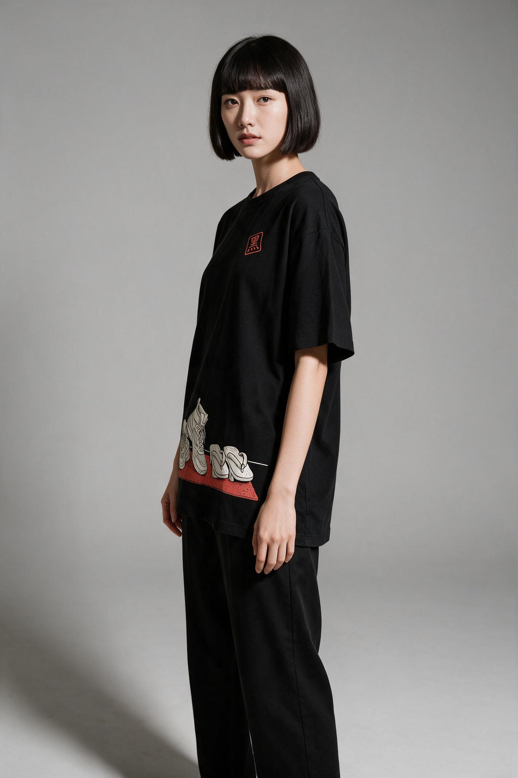 KUROI Genkan oversized tee worn by model