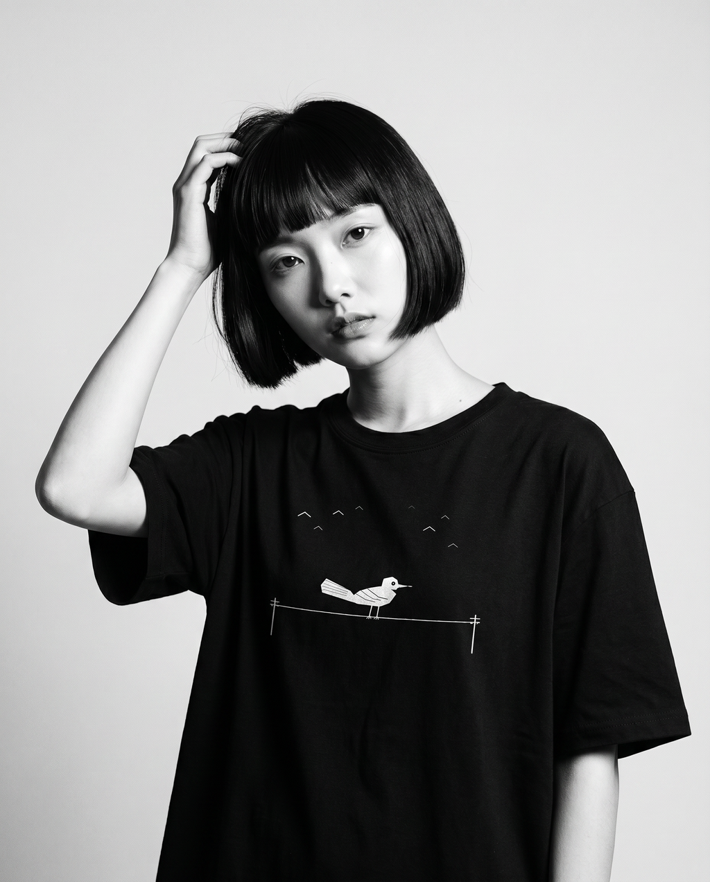 Nagi in the Kuroi Karasu Tee — hand in hair