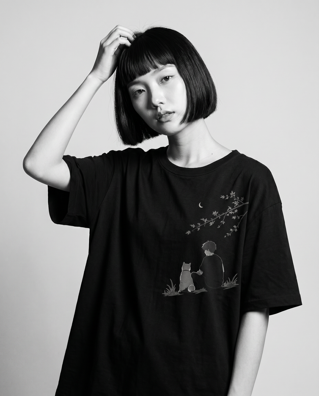 Nagi in the KUROI Shisaku Tee — hand in hair