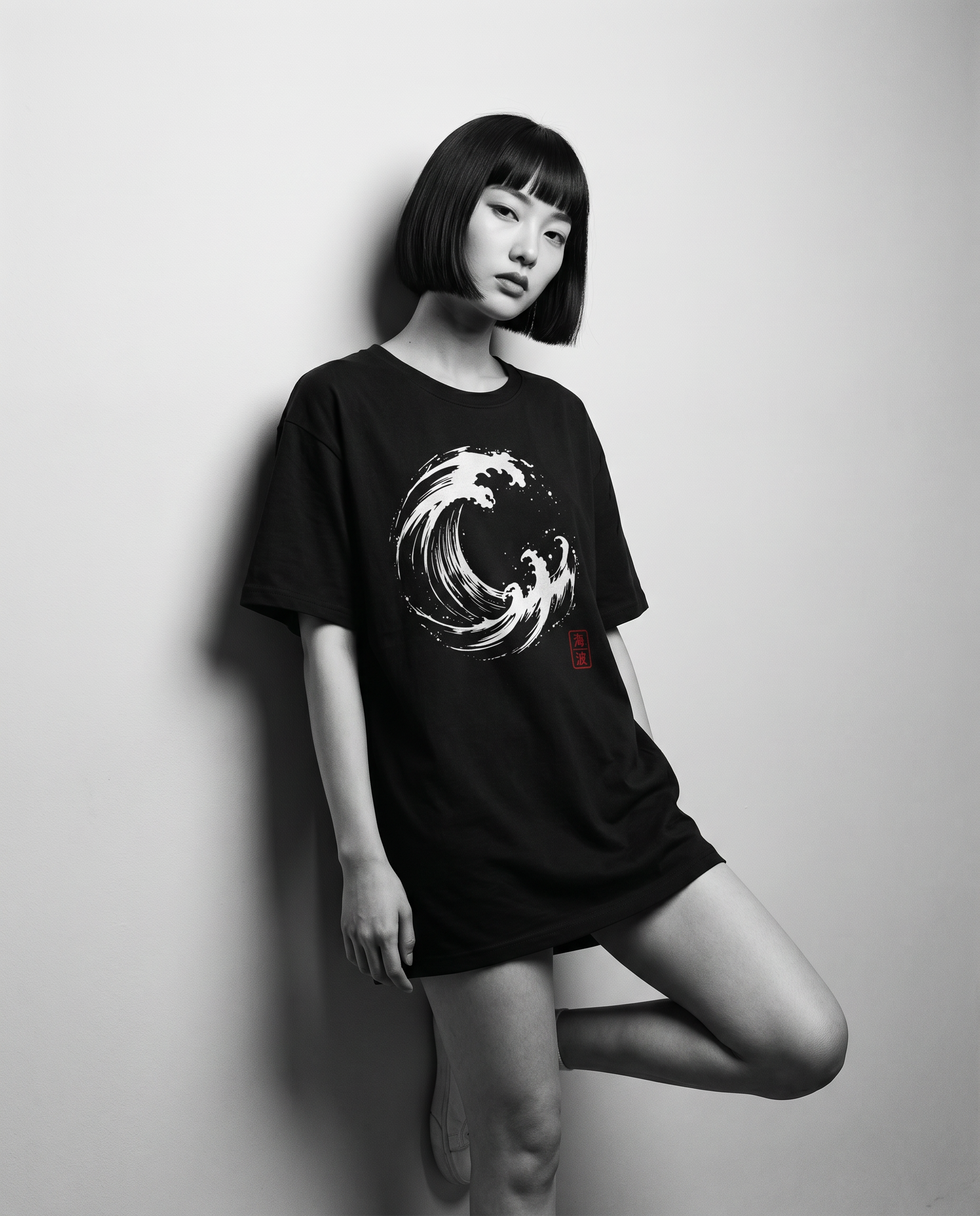 Nagi in the Kuroi Umi Nami Tee — leaning