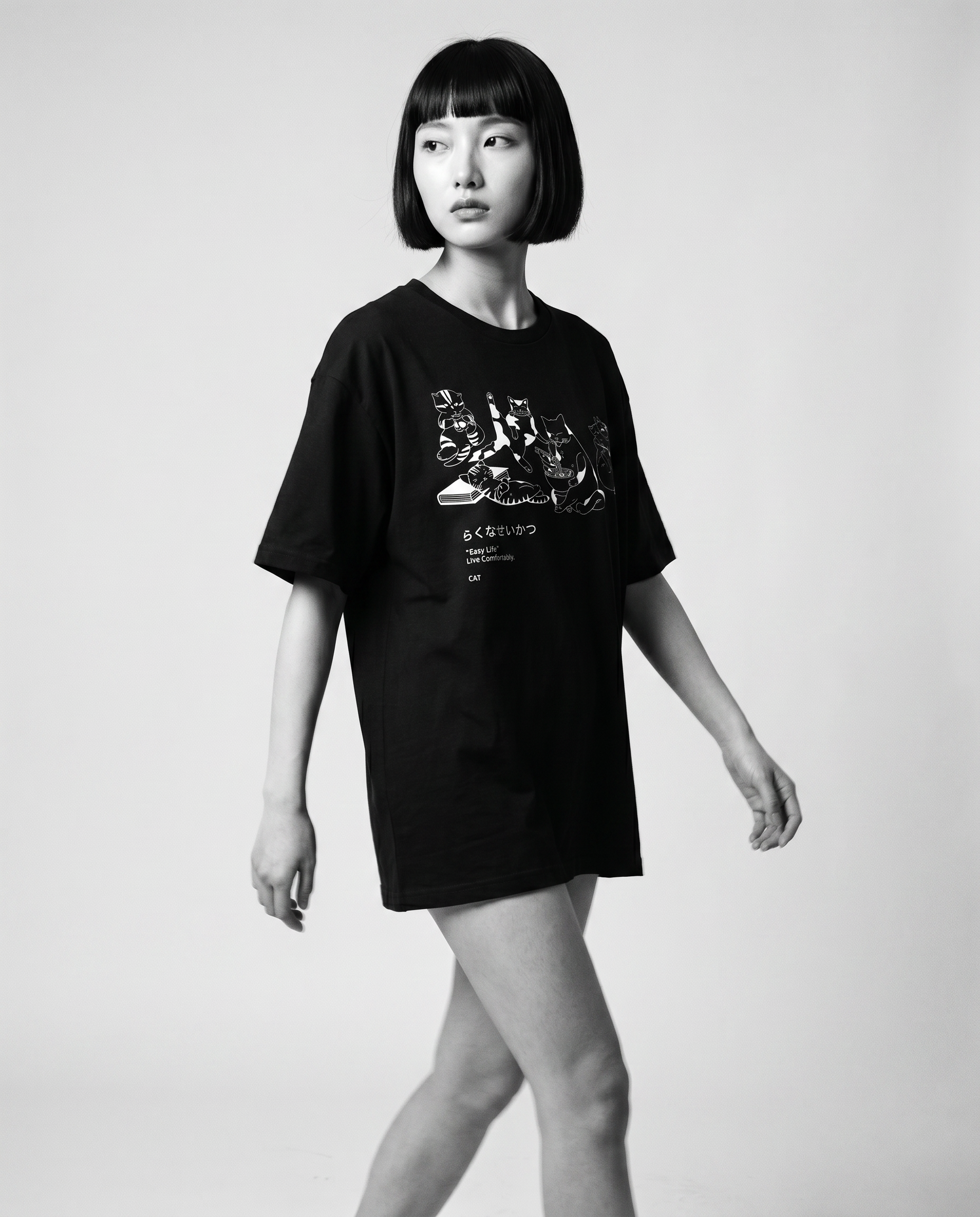 Nagi in the Kuroi Easy Life Cat Tee — walking