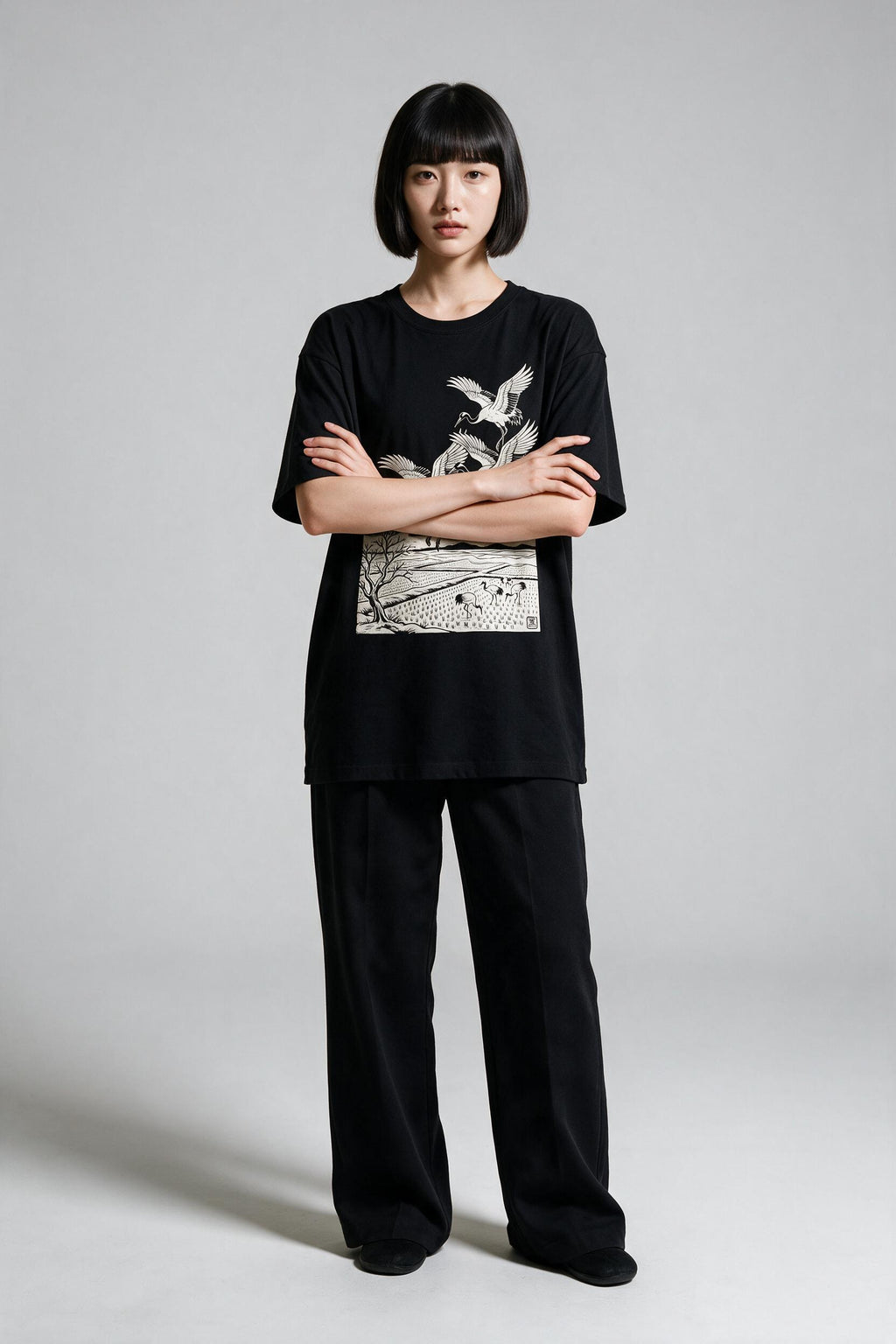 KUROI Tsuru no Sato oversized tee worn by model, arms crossed