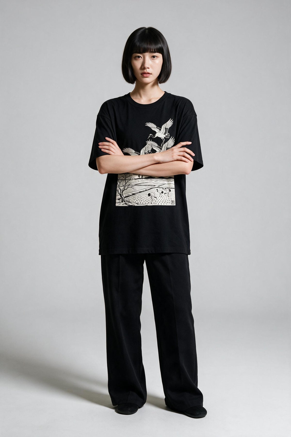 KUROI Tsuru no Sato oversized tee worn by model, arms crossed