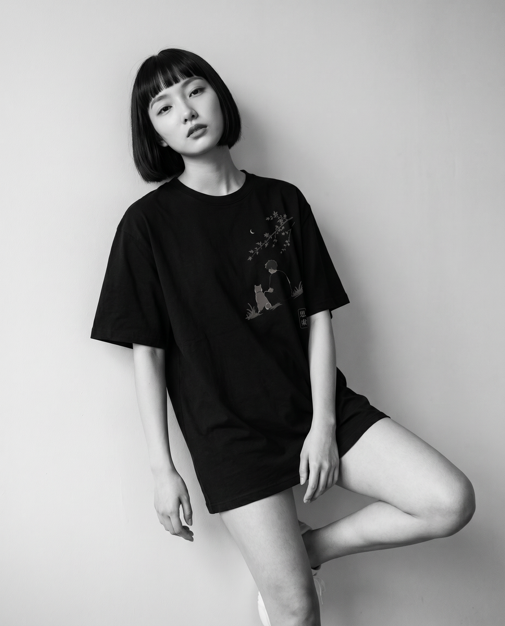 Nagi in the KUROI Shisaku Tee — leaning