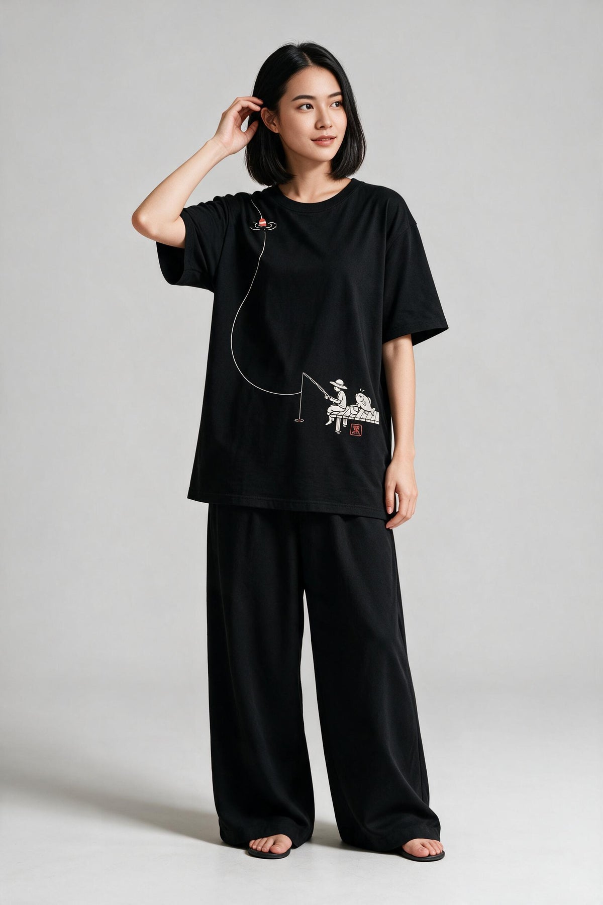 KUROI Tsuri oversized tee worn by model
