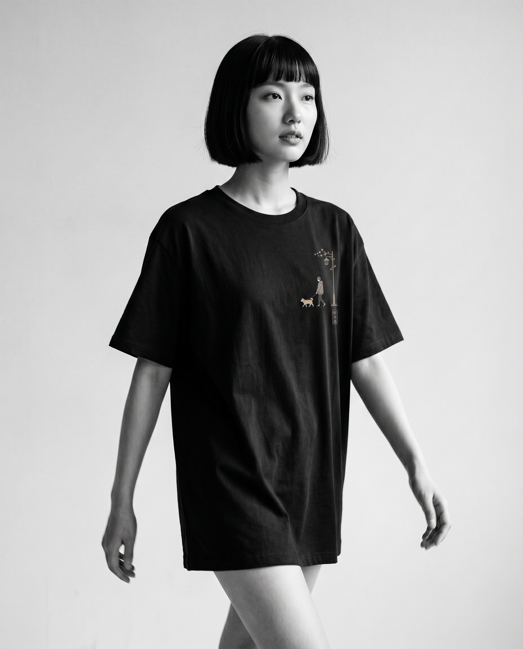 Nagi in the KUROI Sanpomichi Tee — walking
