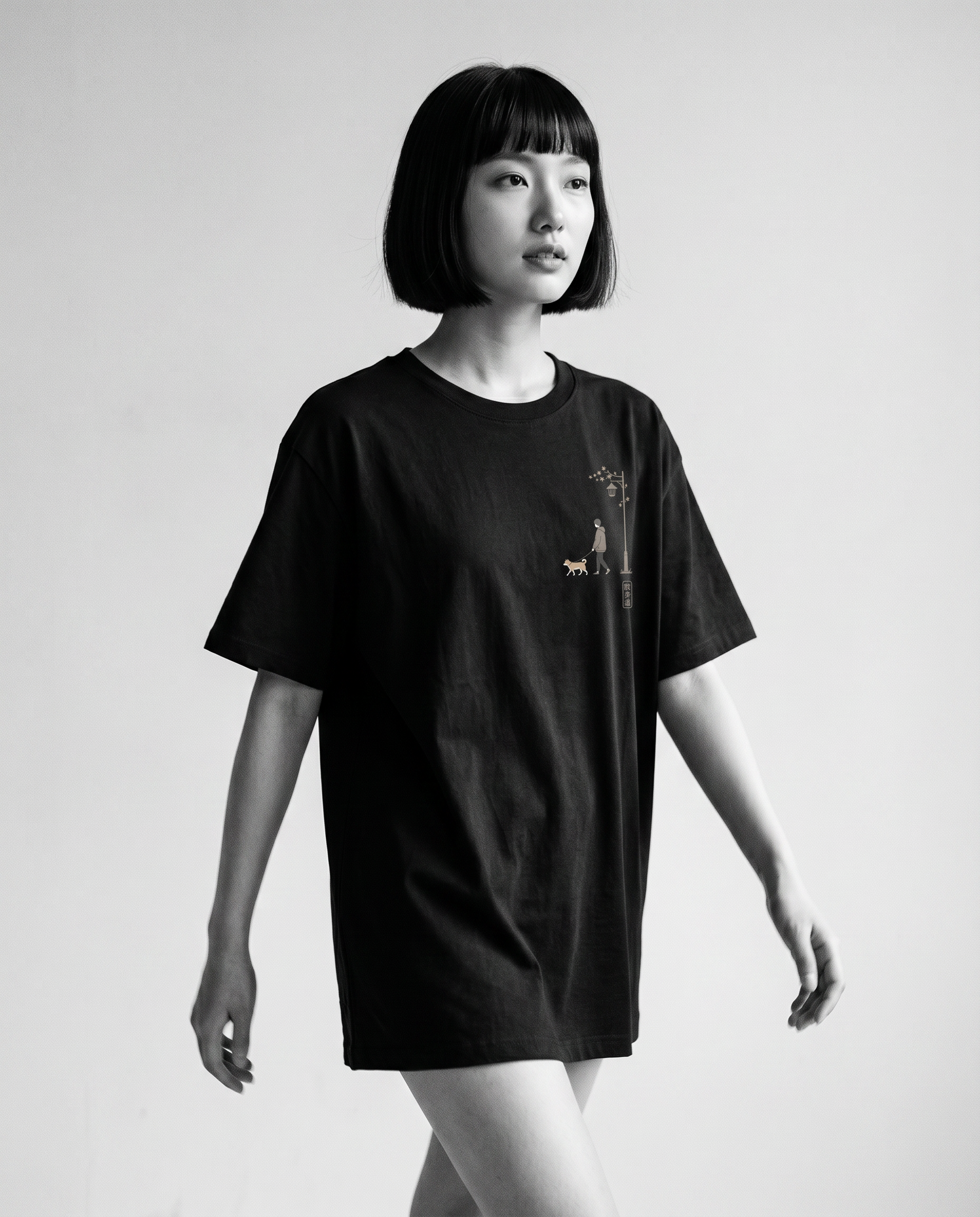 Nagi in the KUROI Sanpomichi Tee — walking
